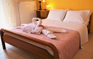 A bed or beds in a room at Villa Fotini with ocean view