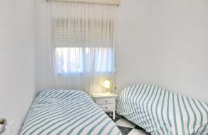 Posteľ alebo postele v izbe v ubytovaní Apartamento Plaza la Fuente