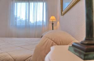 Posteľ alebo postele v izbe v ubytovaní Apartamento Plaza la Fuente