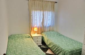 Posteľ alebo postele v izbe v ubytovaní Apartamento Plaza la Fuente