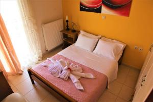 A bed or beds in a room at Villa Fotini with ocean view