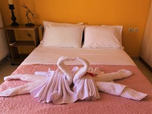 A bed or beds in a room at Villa Fotini with ocean view