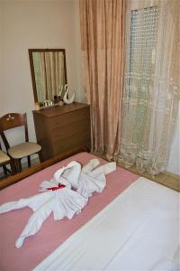 A bed or beds in a room at Villa Fotini with ocean view