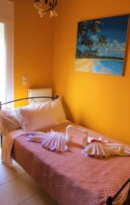 A bed or beds in a room at Villa Fotini with ocean view