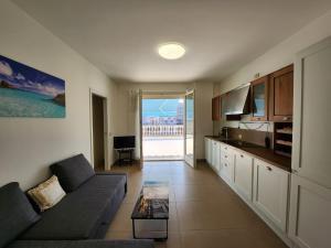 a living room with a couch and a table at Sophie's Oasis in Alba Adriatica