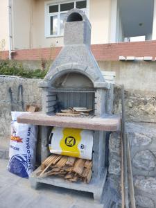 a stone oven with logs inside of it at bungalow in Sinop
