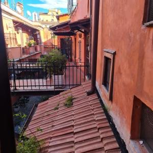 an outside view of a building with a wooden deck at Julia nel cuore di Trastevere in Rome
