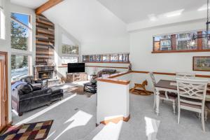 a living room filled with furniture and a table at 4551 Streamside Cir WEST HOUSE in Vail