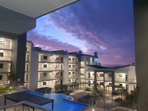 a view of a large apartment building with a pool at 38@Nivica in Langebaan