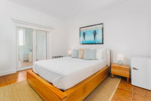 Voodi või voodid majutusasutuse Blue Roatan Resort toas