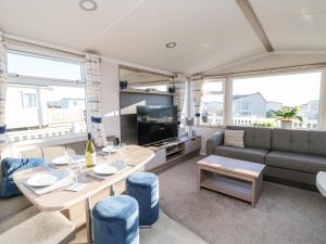 a living room with a couch and a table at 17 Summer Meadows in Ashington