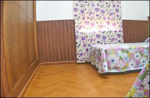 En eller flere senge i et værelse på Casa Maestro Roche