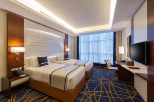 Postel nebo postele na pokoji v ubytování Blue Diamond Hotel Jeddah