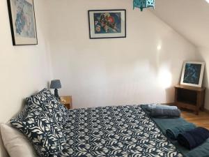 Posteľ alebo postele v izbe v ubytovaní Maison conviviale aux abords de la vieille ville