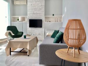 Televízia a/alebo spoločenská miestnosť v ubytovaní ÁTICO VALDELAGRANA PLAYA - Aire Acondicionado y Piscina