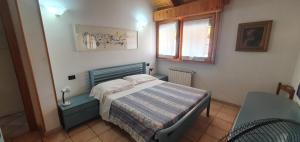 Postel nebo postele na pokoji v ubytování Albergo Primavera