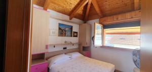 Postel nebo postele na pokoji v ubytování Albergo Primavera