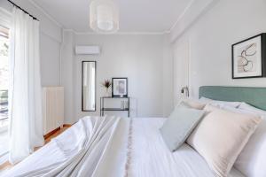 Posteľ alebo postele v izbe v ubytovaní Homey 2BR Apartment in Cholargos by UPSTREET