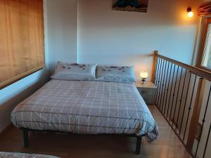 A bed or beds in a room at Casa Rosetta