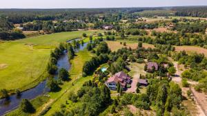an aerial view of a house next to a river at Jeleniec in Stara Rzeka