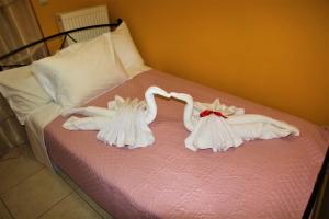 A bed or beds in a room at Villa Fotini with ocean view