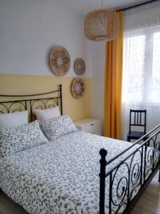 a bedroom with a bed and a window at B&B Le Saline Bed & Breakfast in Cervia
