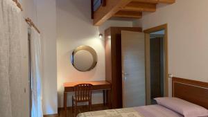 A bed or beds in a room at Casa Rosetta
