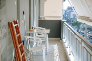 a white table and chairs on a balcony at Friendly Flat 5 in Edessa