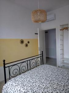 a bedroom with a bed and a ceiling at Le Saline Bed & Breakfast in Cervia