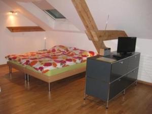 Postel nebo postele na pokoji v ubytování Zytturm Stadt Luzern