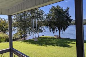 a view of the water from the porch of a house at Lake House Lakeside Escape 1 Bass Fishing Spot Chickamauga in Decatur