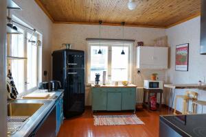 Kuchyň nebo kuchyňský kout v ubytování Arctic Garden Design Villa