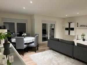 a living room with a couch and a table at Feel Like Your Home in Montijo