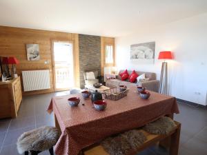 a living room with a table with bowls on it at Appartement Les Gets, 3 pièces, 6 personnes - FR-1-623-98 in Les Gets