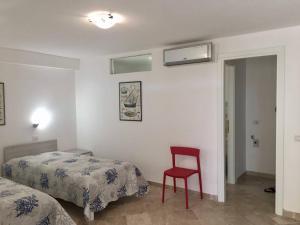 Ένα ή περισσότερα κρεβάτια σε δωμάτιο στο Reihenhaus Nr. 7 mit Pool und super Meersicht +26 φωτογραφίες