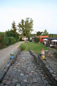 a stone path with colorful bowls on top of it at Cour De Berlin in Fürstenberg