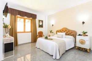 Cama o camas de una habitación en Hotel Plaza Del Castillo