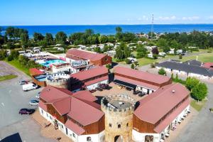 una vista aérea de un edificio con una torre en First Camp Hasmark Camping Resort & Cottages, en Otterup