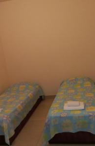 Postel nebo postele na pokoji v ubytování Pousada Favela Cantagalo