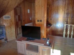 a living room with a flat screen tv on a table at حاتم للعقارات افران المغرب in Ifrane