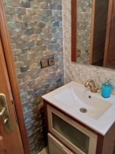 a bathroom with a sink and a mirror at حاتم للعقارات افران المغرب in Ifrane