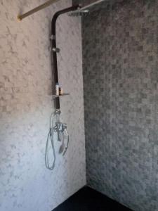 a shower in the corner of a bathroom at حاتم للعقارات افران المغرب in Ifrane