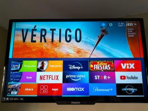 a television screen with the word verica on it at LOFT PLAYAS "A" , a unos pasos del malecon estadio acuario y letras in Mazatlán