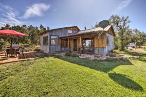 a house with a large yard in front of it at Idyllic Dolores Cabin with Fire Pit and Lake Views! in Dolores