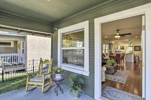a front porch with a chair and a window at Ideally Located Chico Home - Fire Pit and Grill in Chico