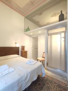 A bed or beds in a room at Boutique Rooms and Breakfast GranVeliero