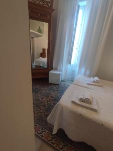 A bed or beds in a room at Boutique Rooms and Breakfast GranVeliero