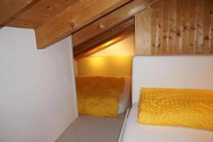 a room with two beds in it with a window at Casa SagognLaax in Sagogn