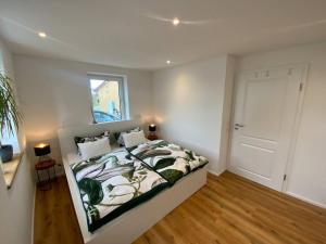 Postel nebo postele na pokoji v ubytování Ferienwohnung Weitblick