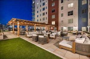 an outdoor patio with furniture and a pergola at Palatial Abode Nashville With Downtown View & Free Parking in Nashville